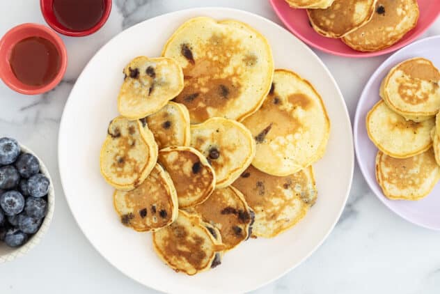 chocolate chip pancakes on plates.