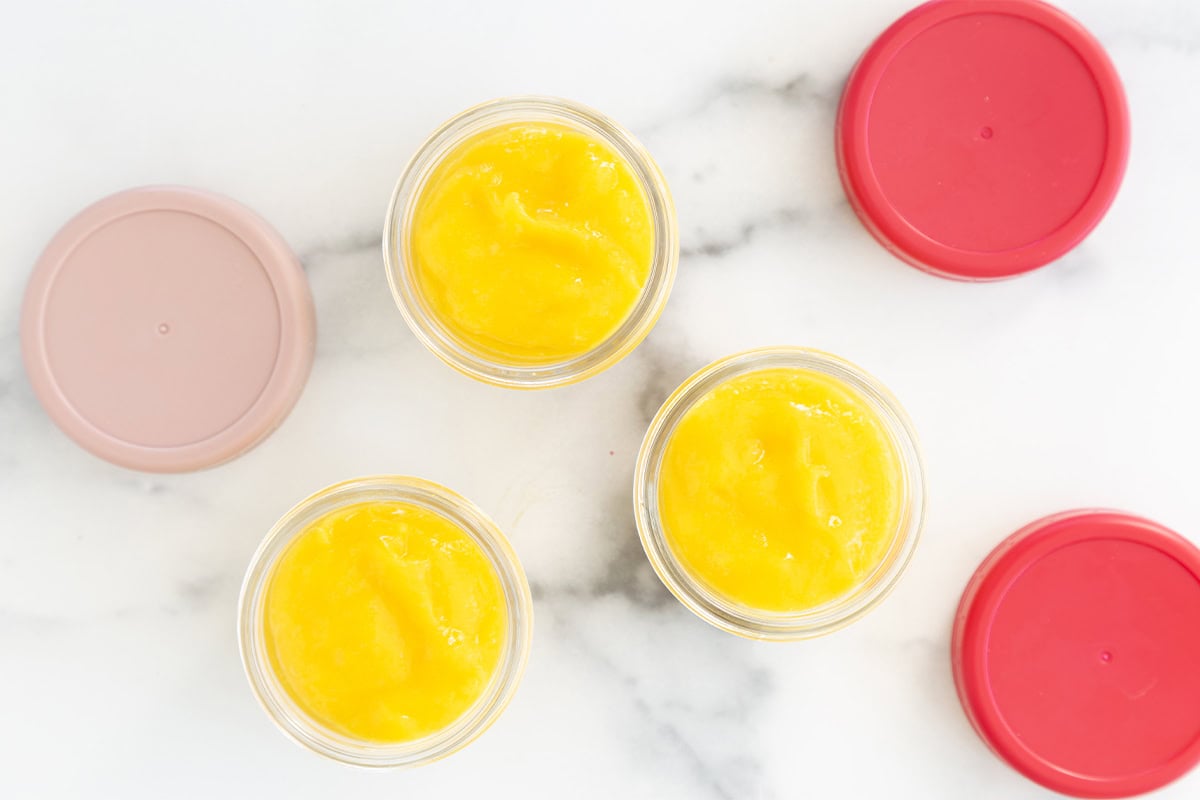 mango puree in baby food containers.