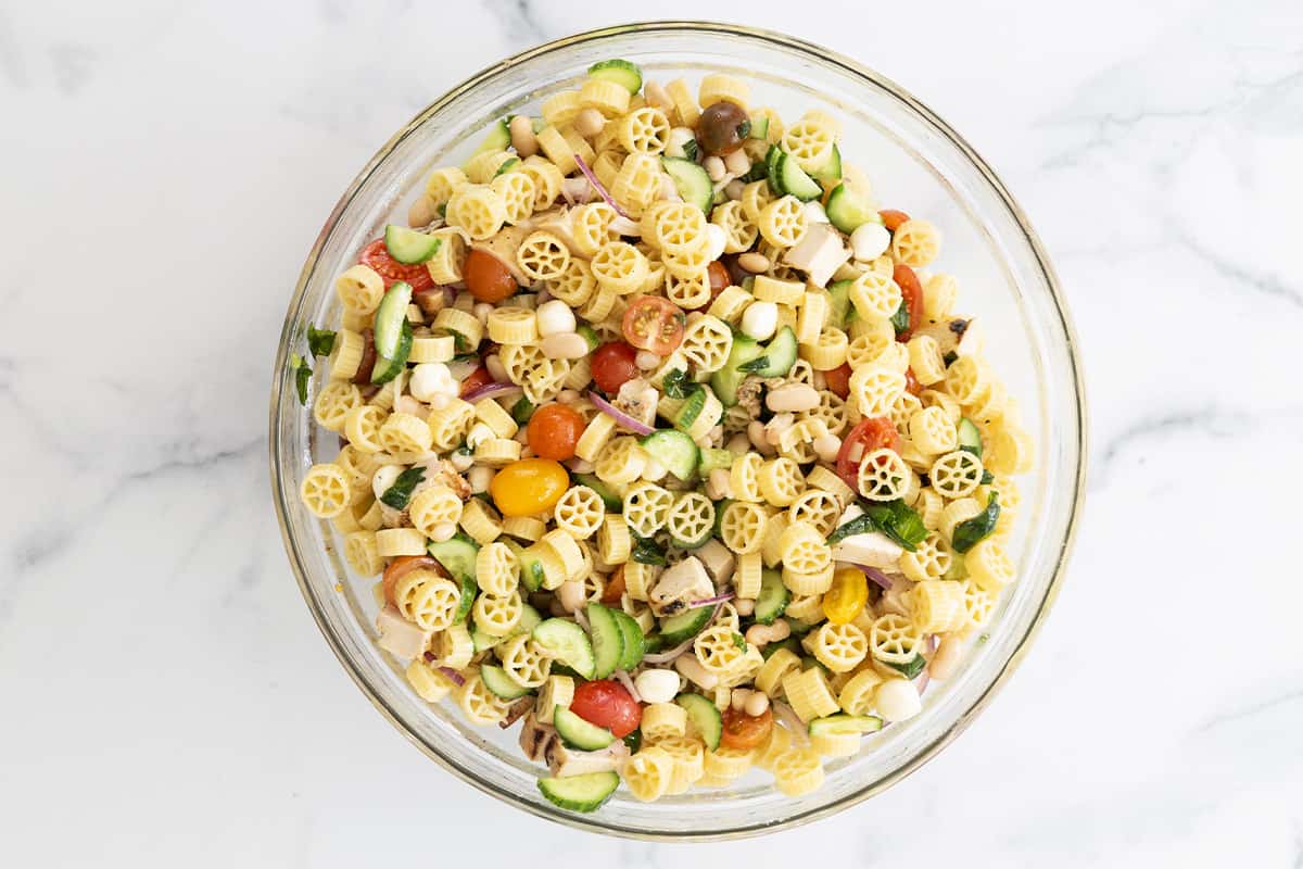 pasta salad with chicken in bowl on counter.
