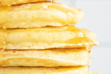 Stack of ricotta pancakes on plate.