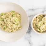 Cheesy broccoli rice in two white bowls.