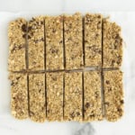 Chewy granola bars on parchment paper.