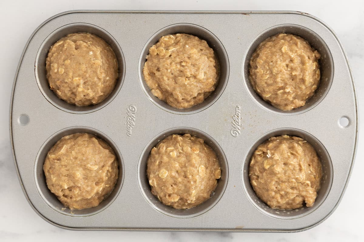 oatmeal muffins in muffin pan before baking.