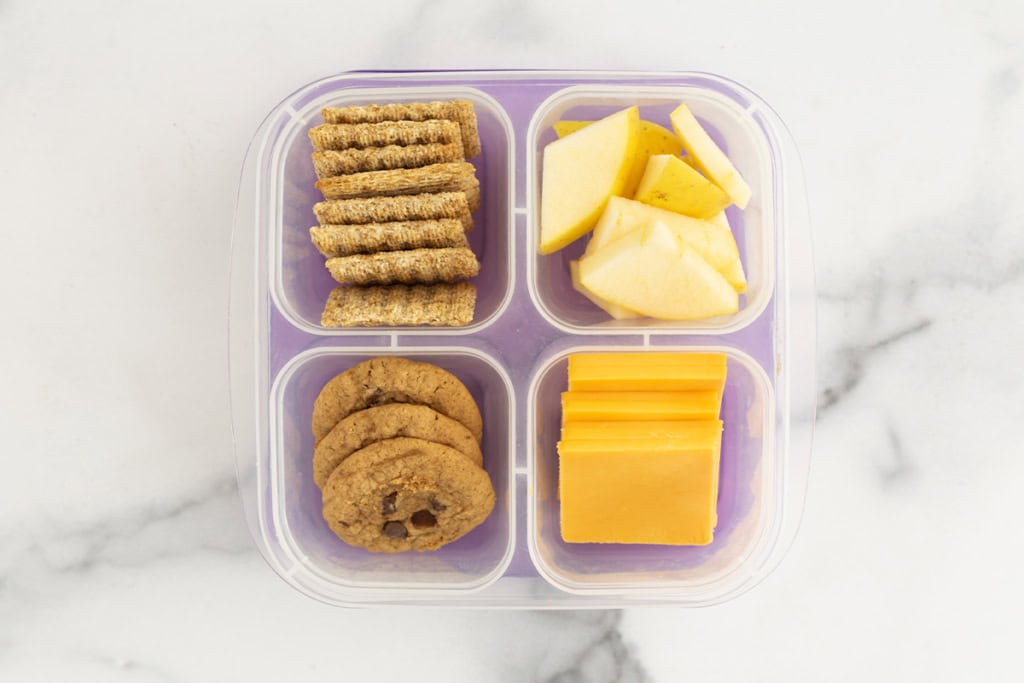 Homemade lunchable with cheese, cookies and crackers.