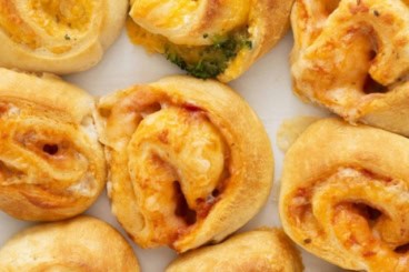 Pinwheels, in three flavors, on baking sheet.