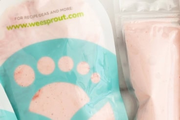 Strawberry yogurt pouches on countertop.