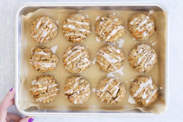 healthy oatmeal cookies on tray with hand.