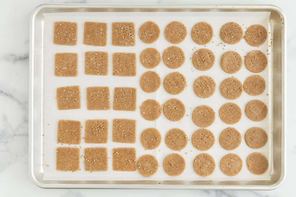 Homemade crackers on baking pan before baking.