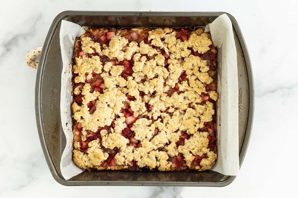 Strawberry oatmeal bars in baking pan after baking.