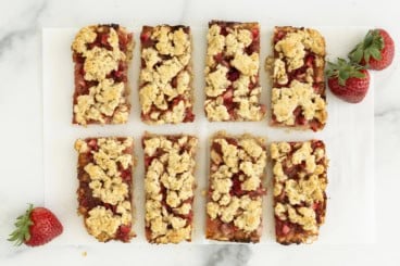 Strawberry oatmeal bars cut into rectangle pieces.