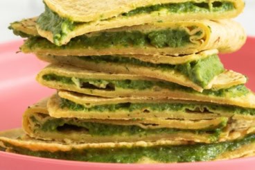 Spinach Quesadillas stacked on pink plate.