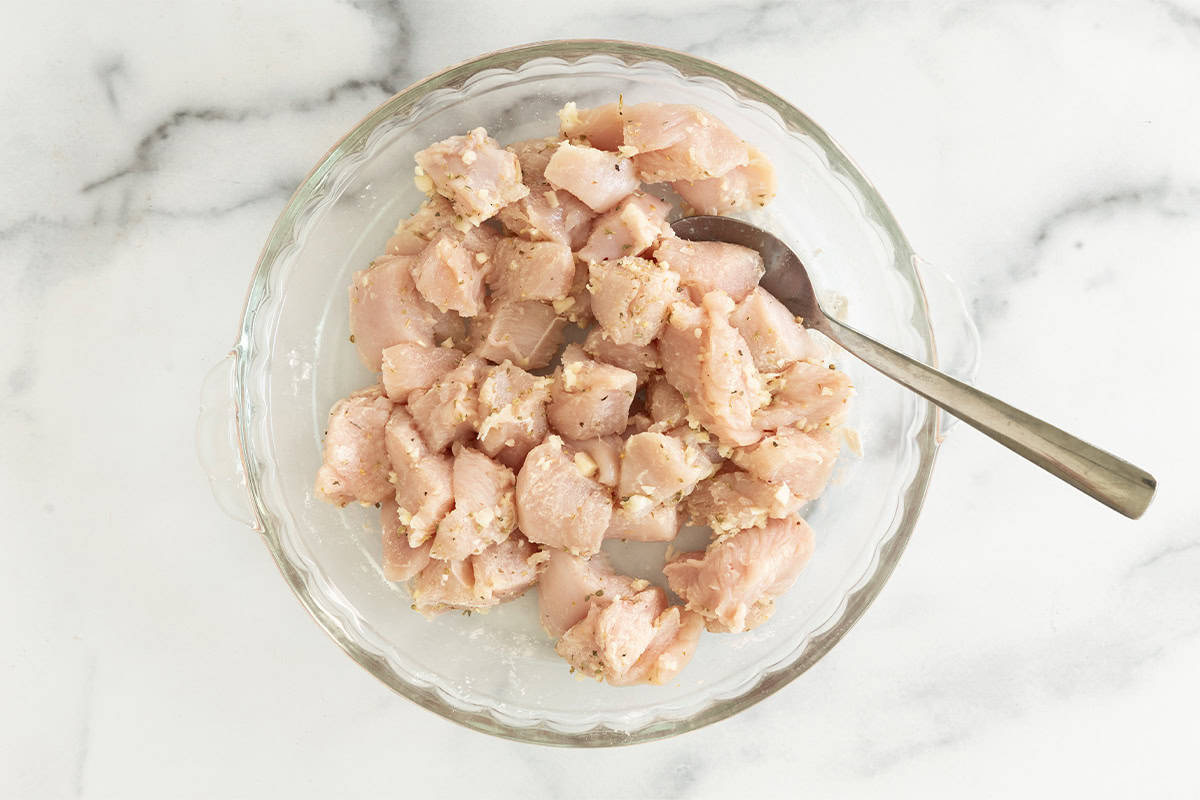 Chicken bites in glass bowl before cooking.