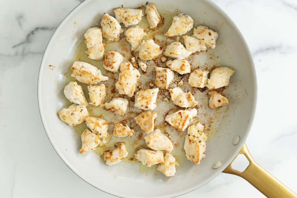 Chicken bites in pan after frying.