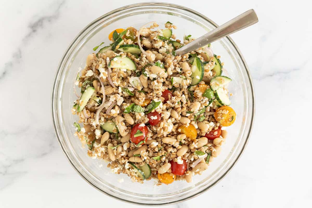 Farro salad in glass bowl.