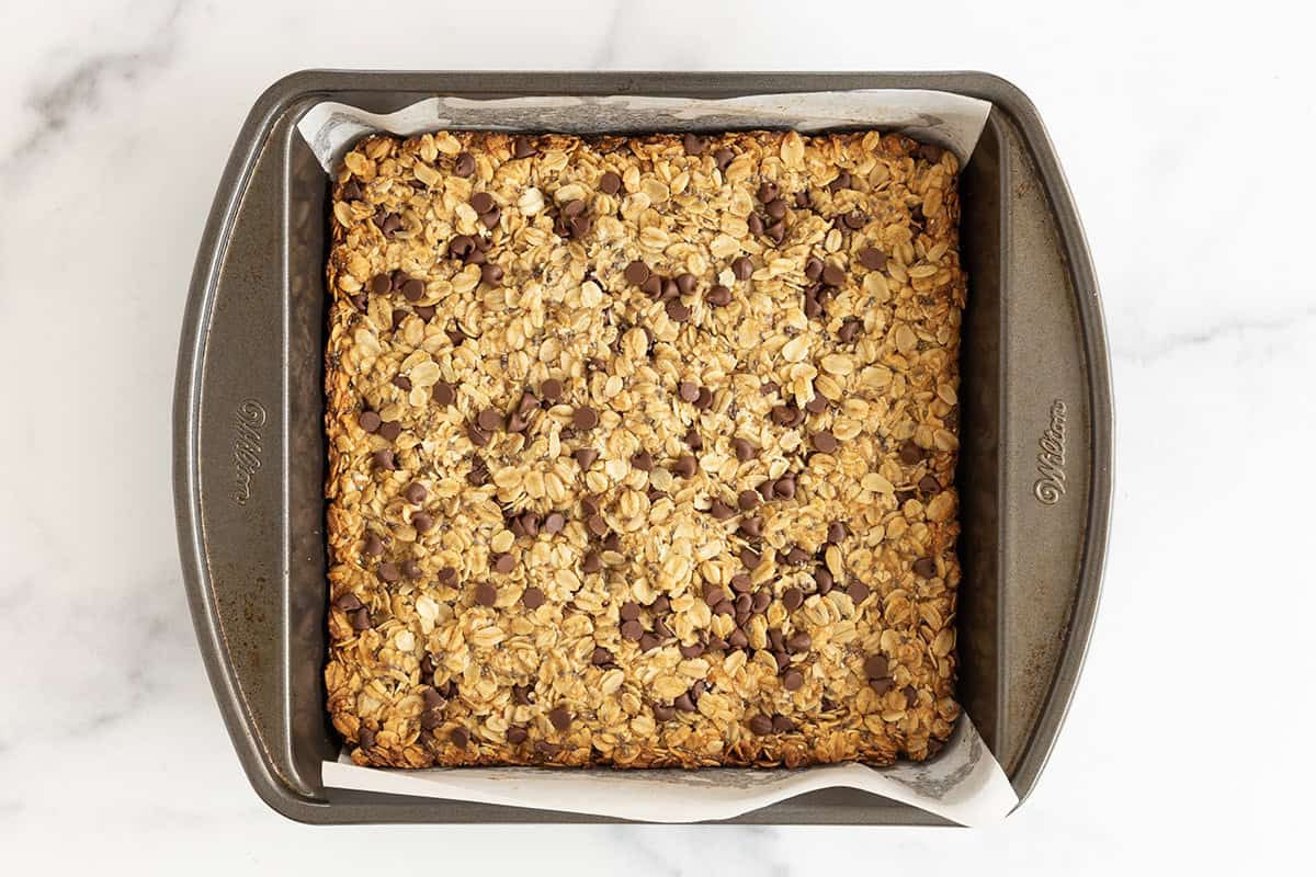 Healthy granola bars in baking pan after baking.