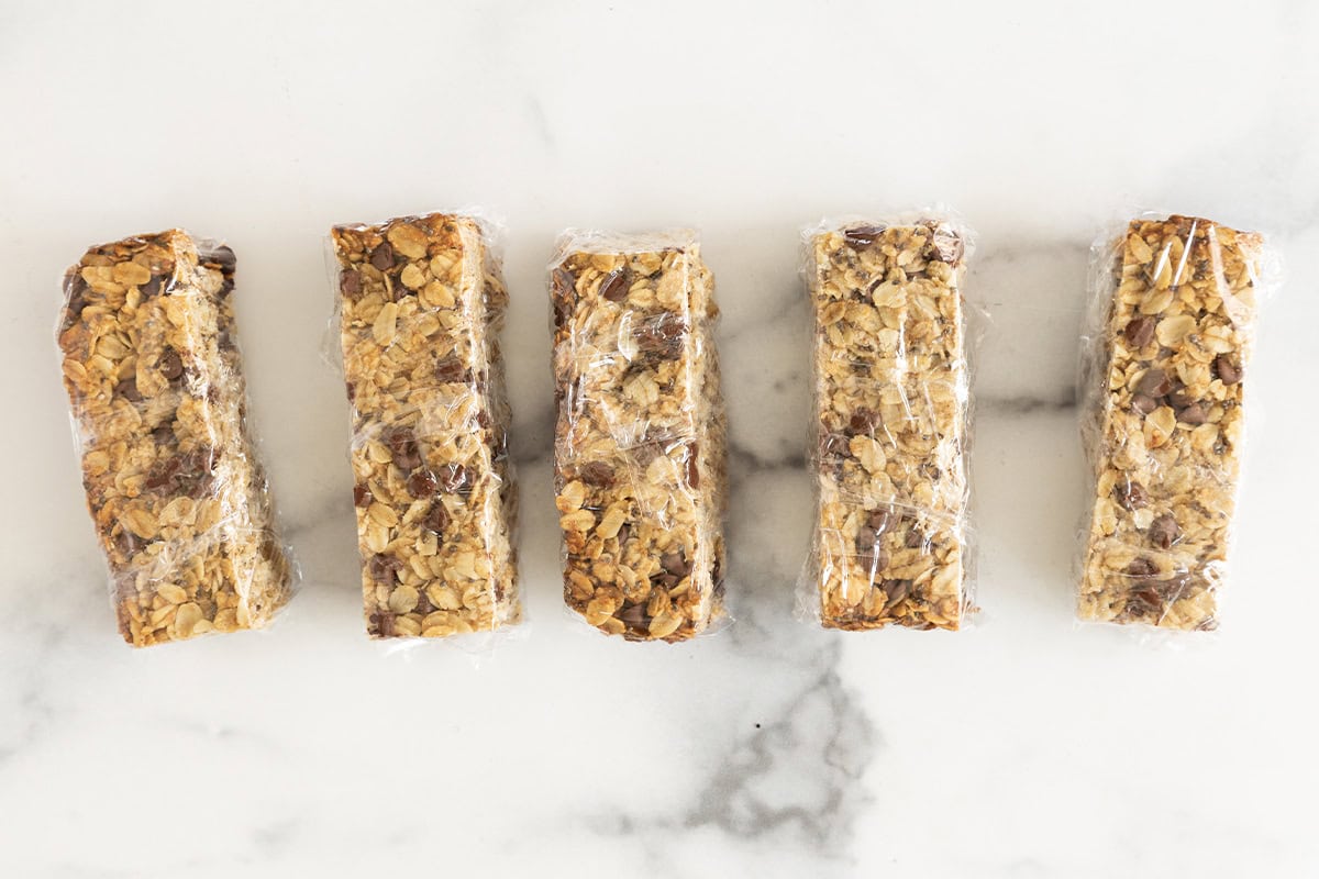 Healthy granola bars lined up on countertop.