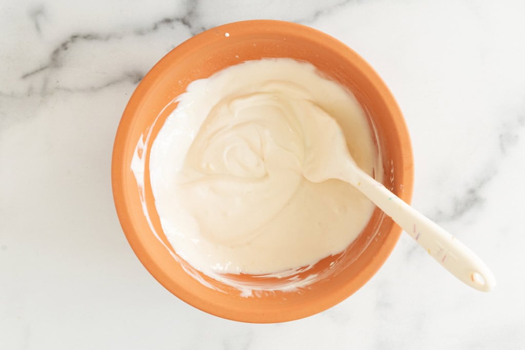 Lemon yogurt in large mixing bowl.