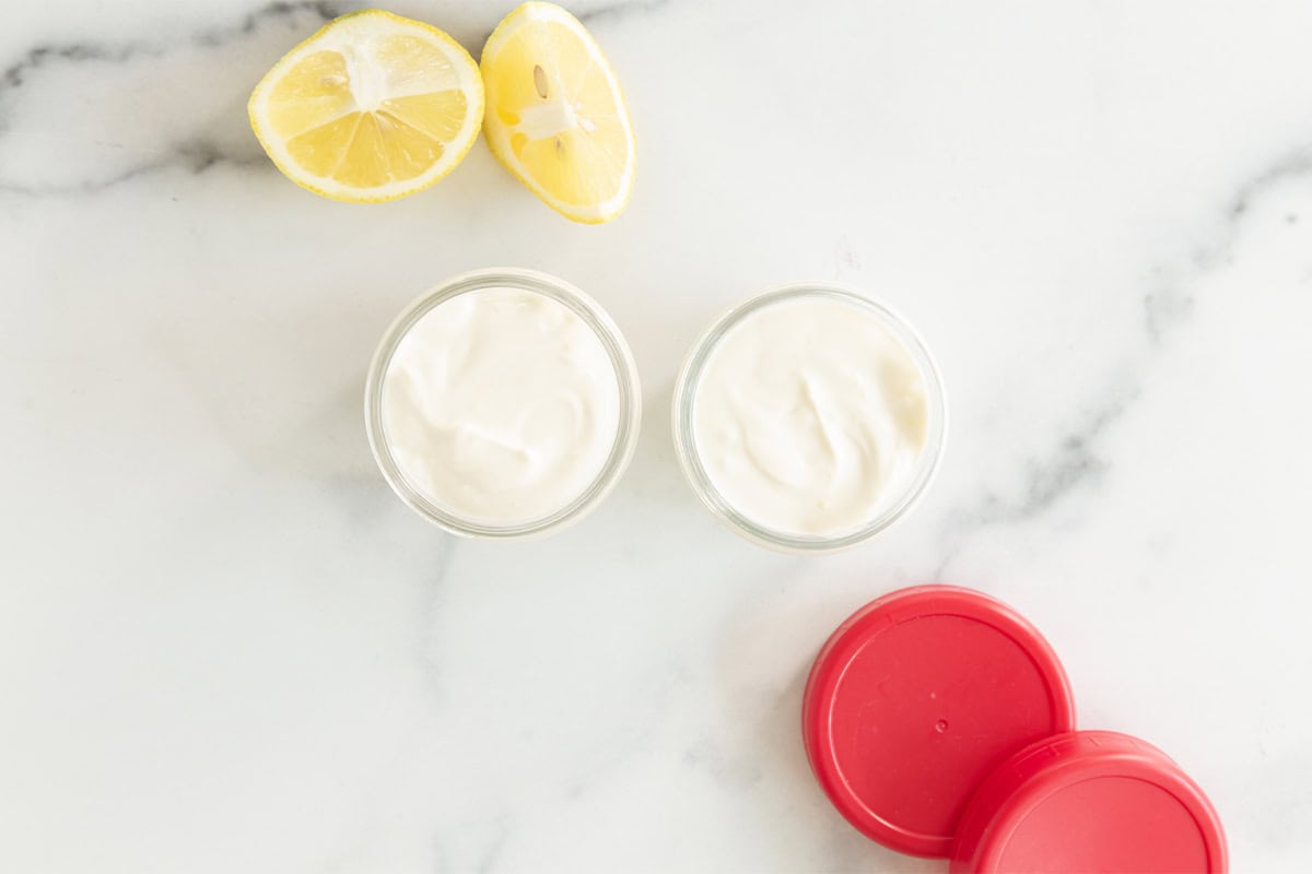 Lemon yogurt in glass storage containers.