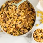 Pan and bowl of taco pasta.