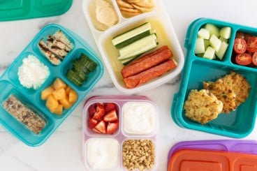 Protein lunch ideas in multiple lunchboxes.