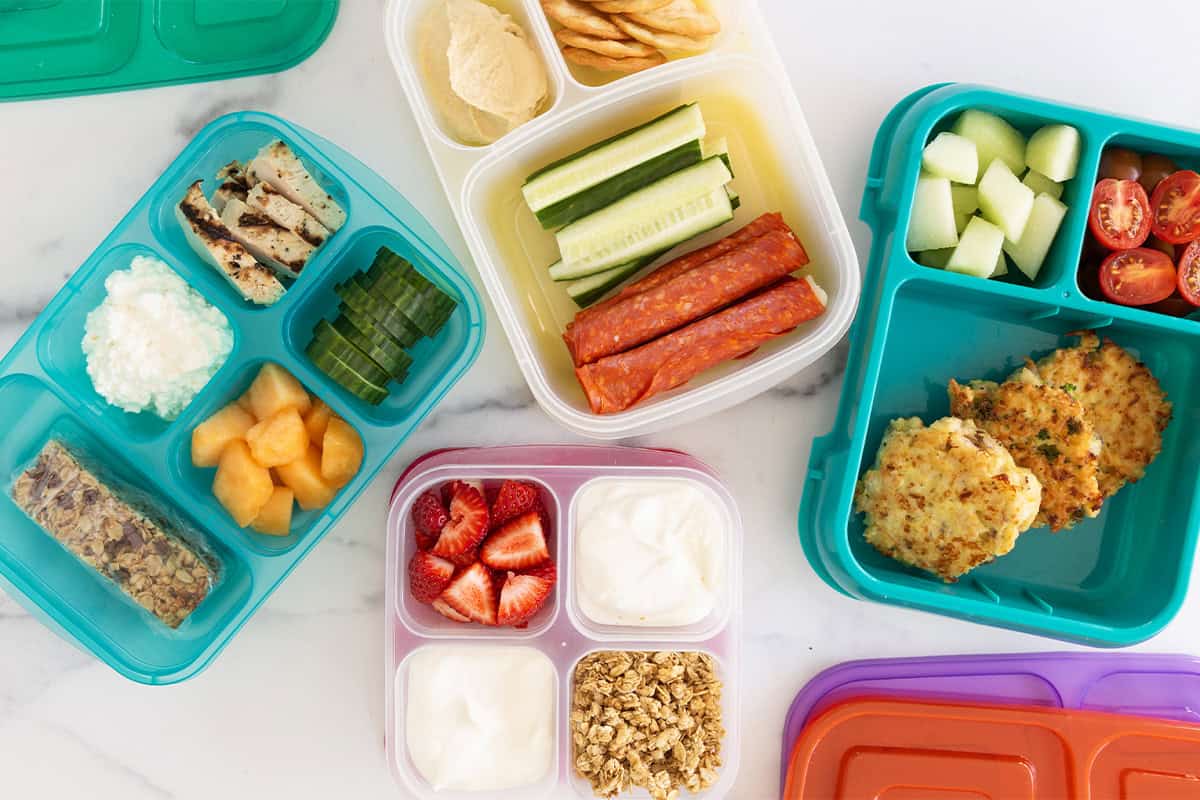 Protein lunch ideas in multiple lunchboxes. 