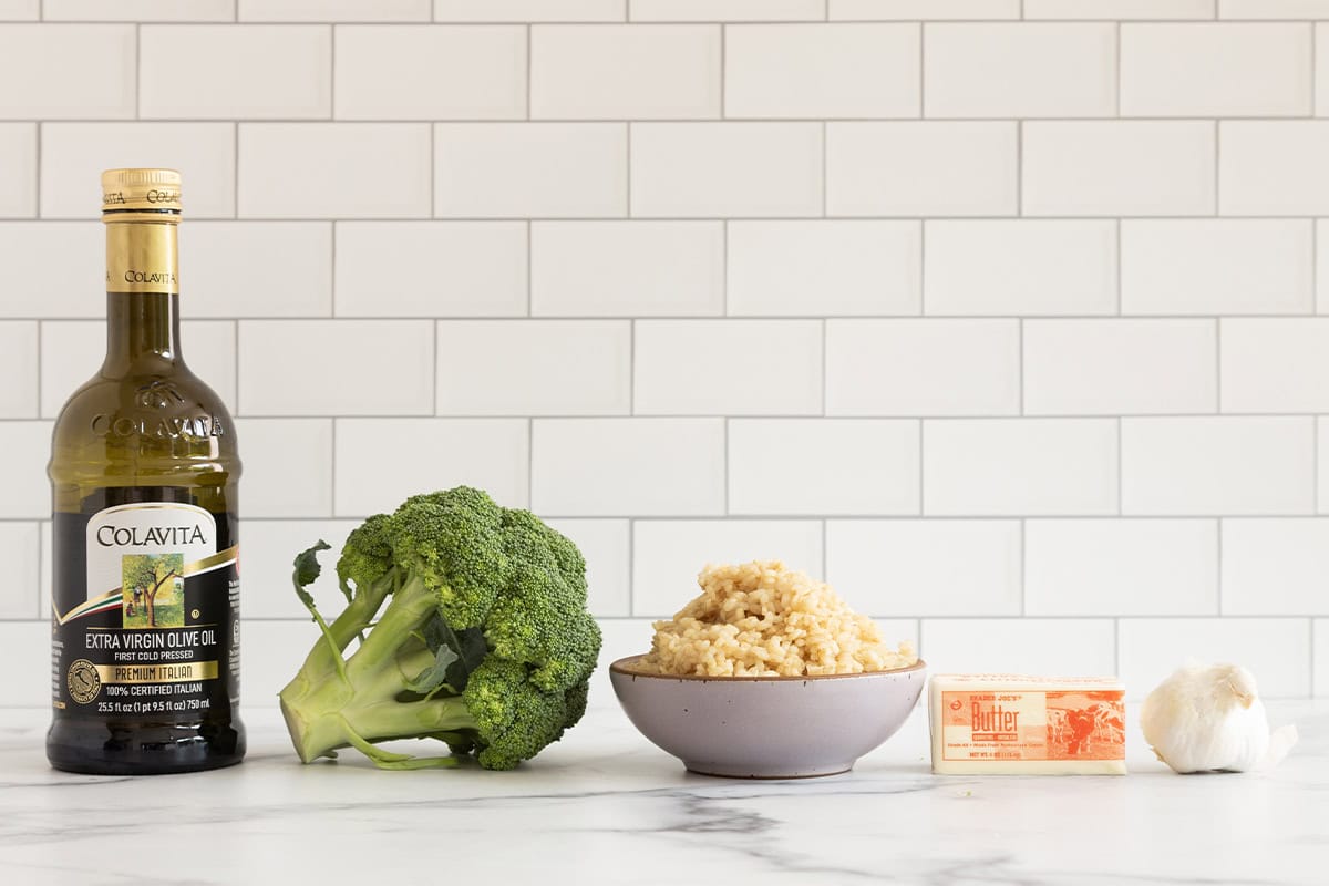 Ingredients for broccoli rice on countertop.