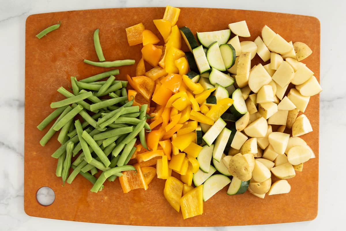 Veggies cut on cutting board for giambotta.