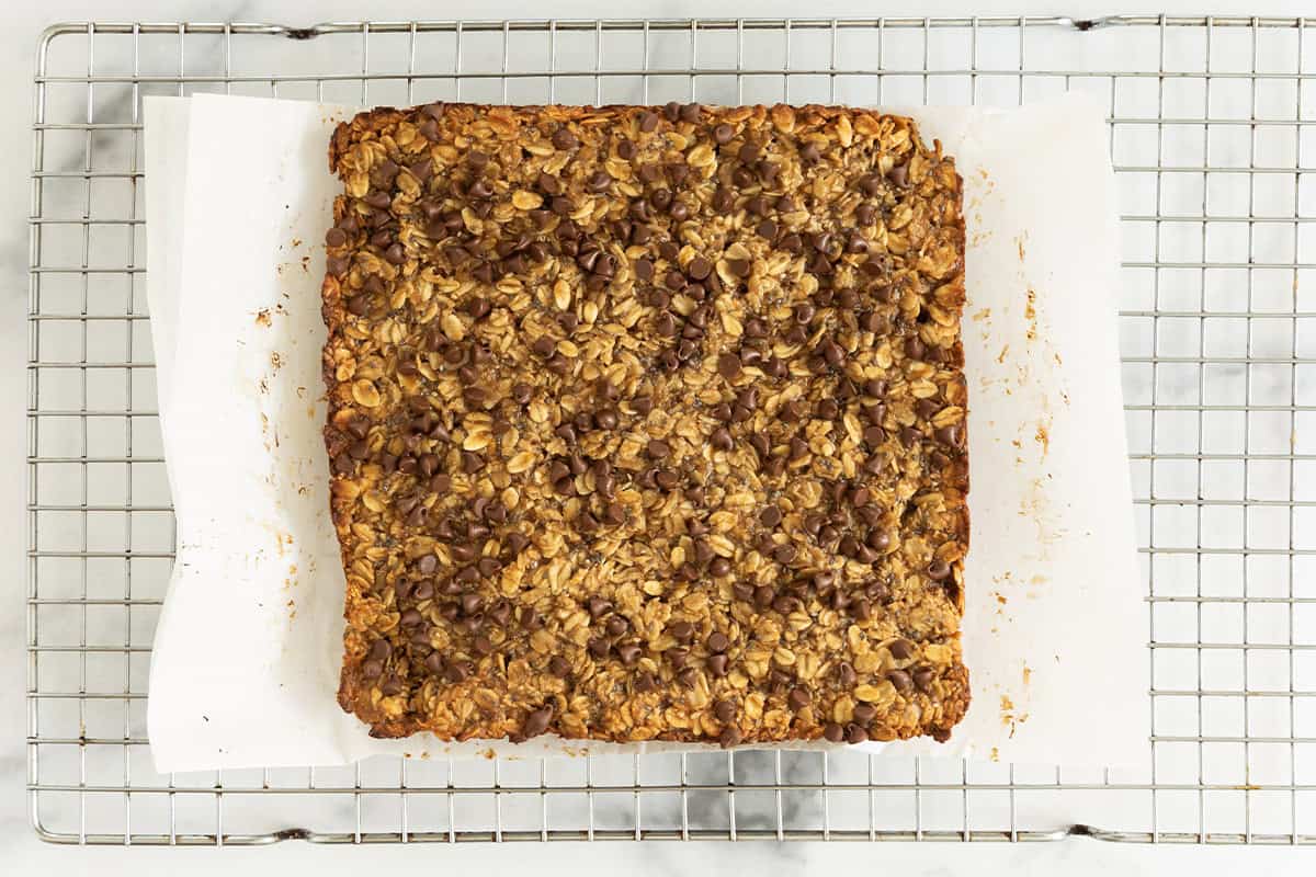 Peanut butter granola bars on cooling rack before slicing.