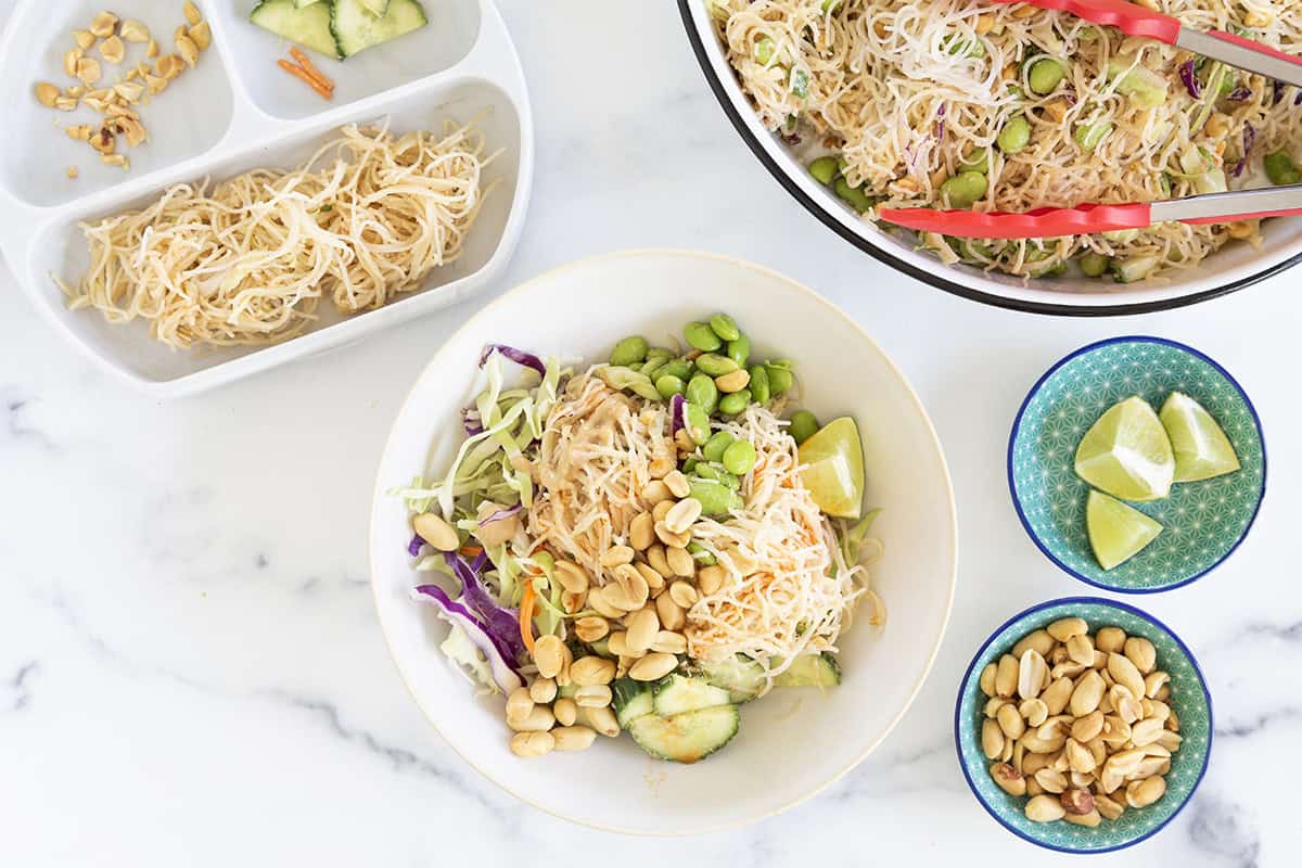 bowls of rice noodle salad for family on counter.