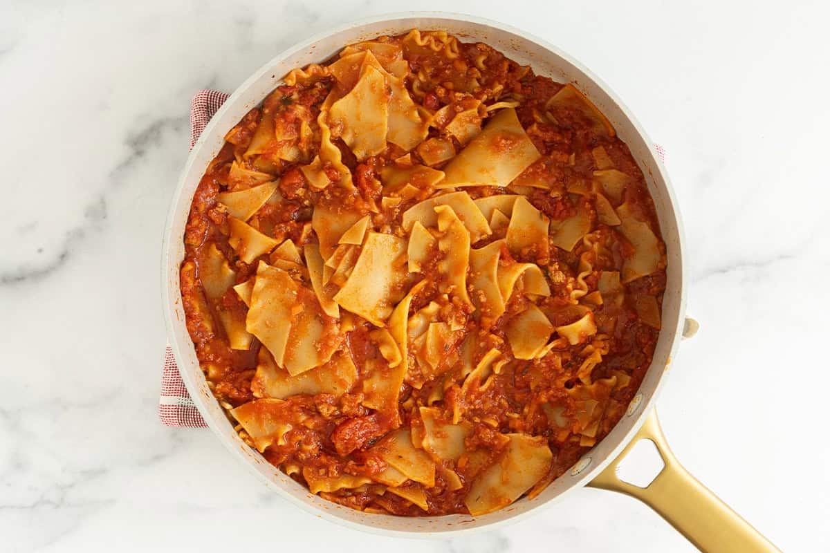 Skillet lasagna in pan before adding cheese.