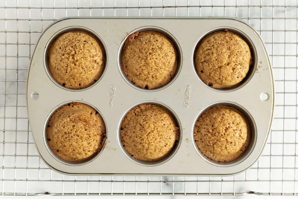 Apple oatmeal muffins in muffin pan after baking.