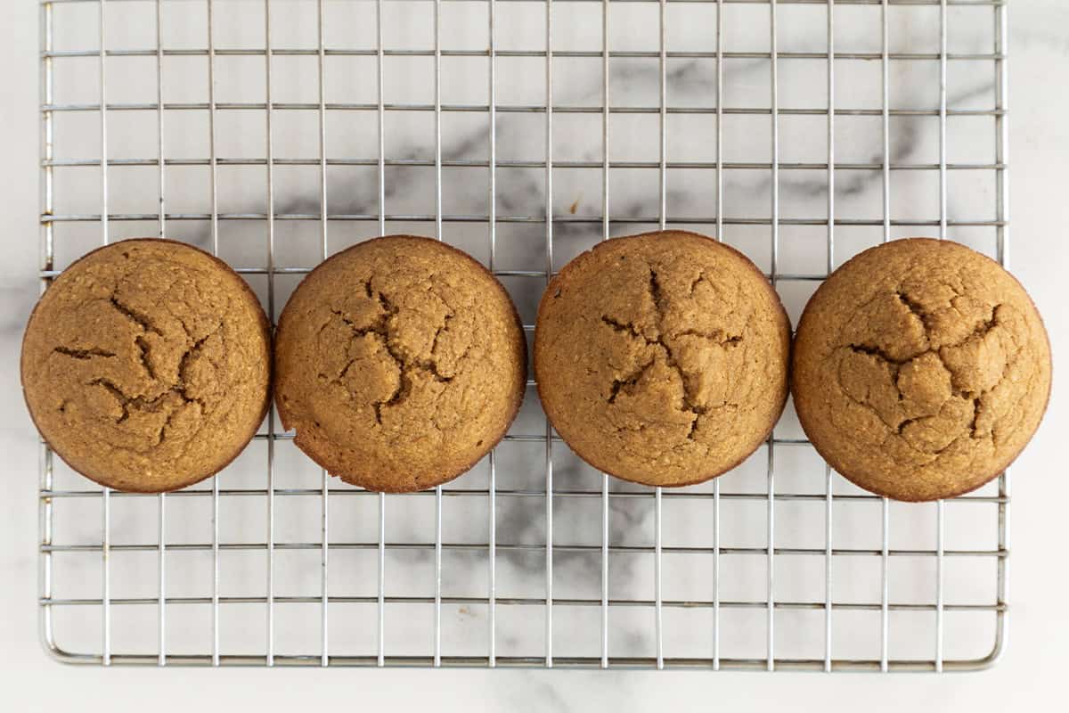 Apple oatmeal muffins on cooling rack.