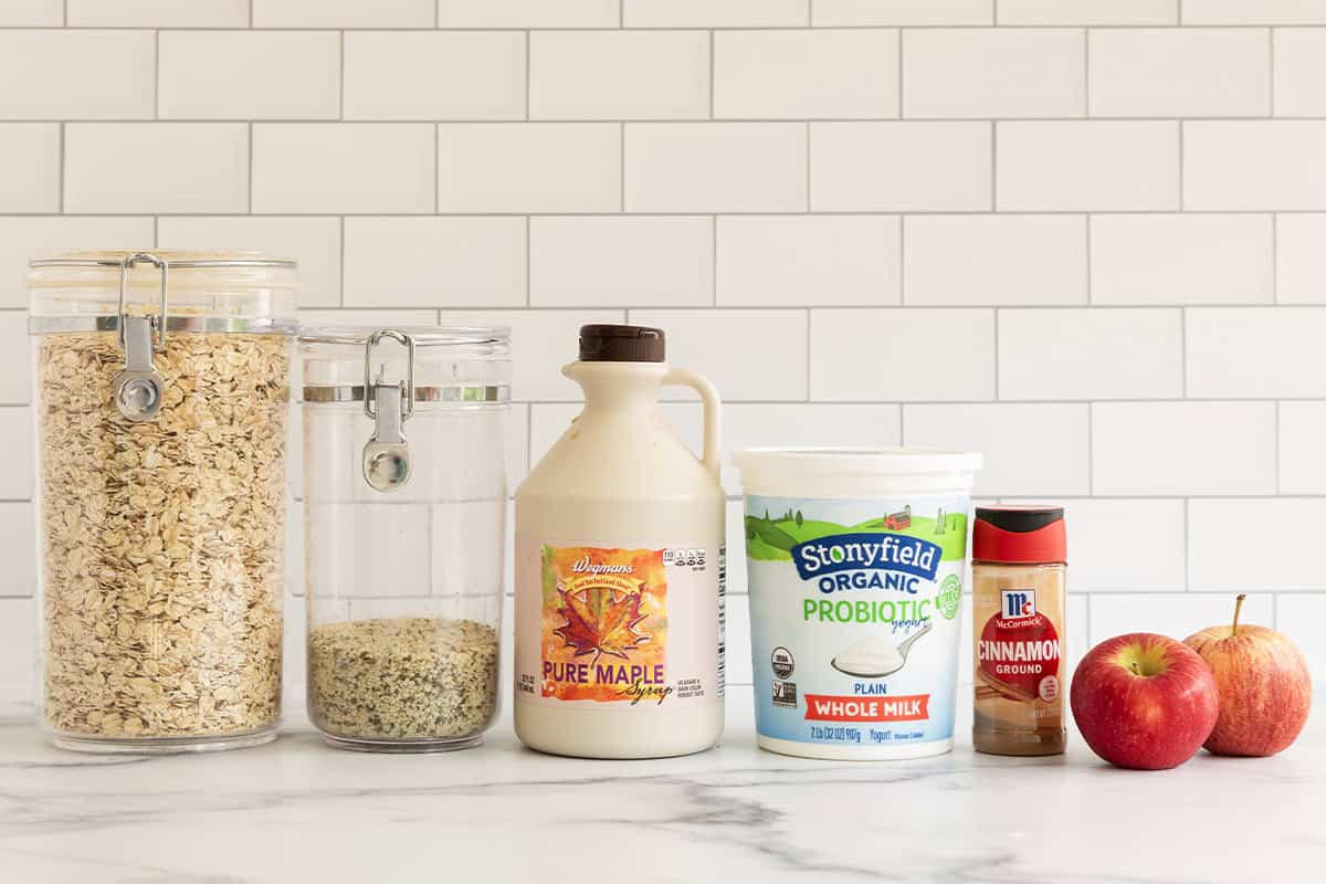 Ingredients for apple overnight oats on countertop.