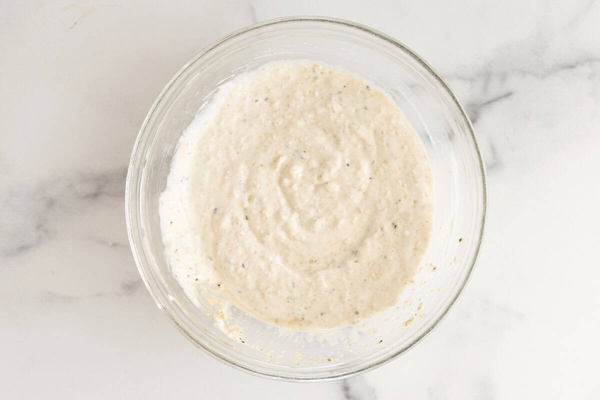 Apple overnight oats in glass bowl.