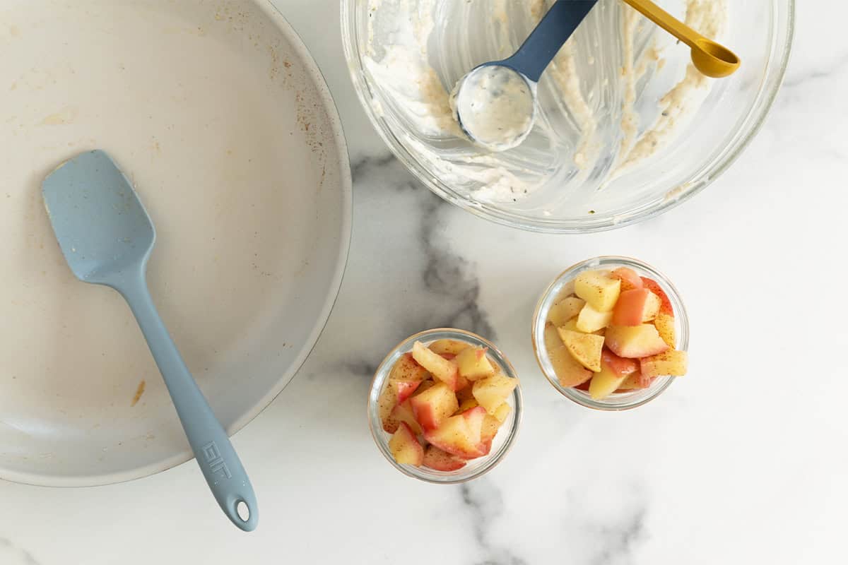 Making apple overnight oats in glass jars.