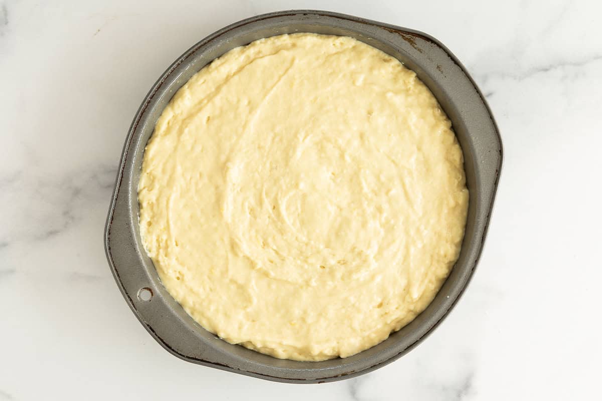 Batter for greek yogurt cake in pan before baking.