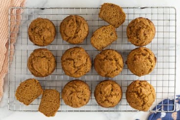 Pumpkin banana muffins on cooling rack.