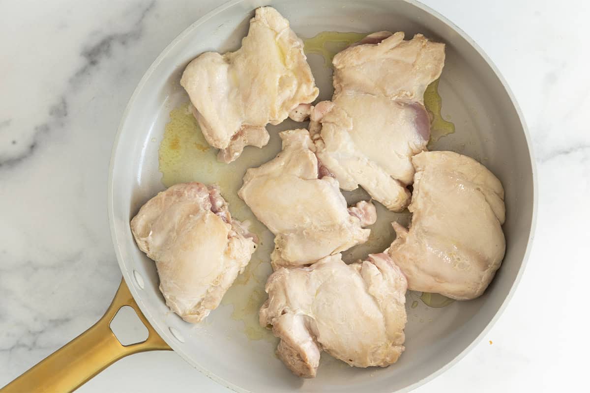 Chicken in frying pan for salsa chicken tacos.