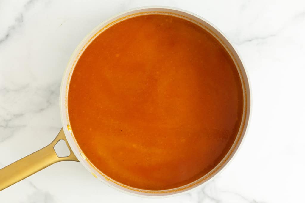 Tomato sauce in pot for pastina soup.