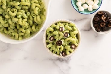 Halloween pasta in two bowls with sides.