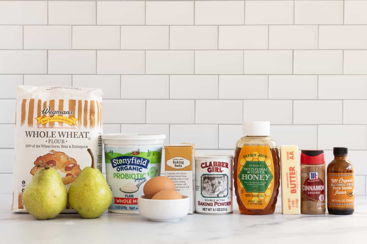 Ingredients for pear muffins on countertop.