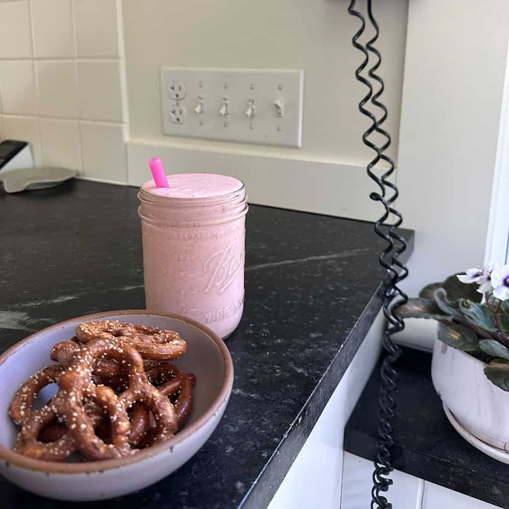 smoothie and pretzels on counter.