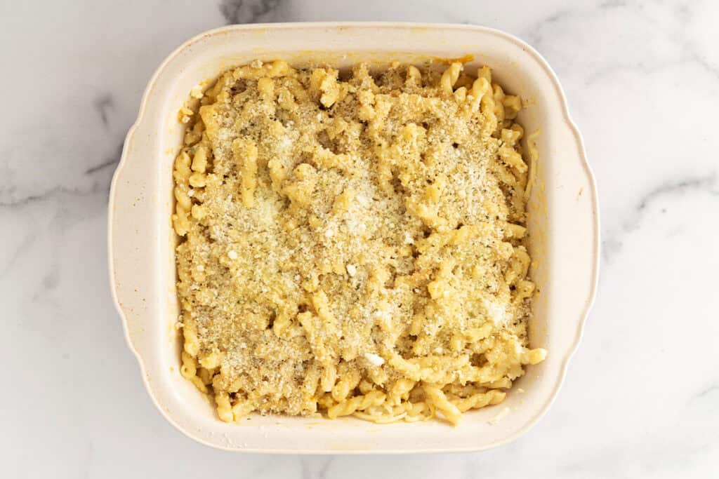 pasta with butternut squash sauce and breadcrumbs in baking dish.