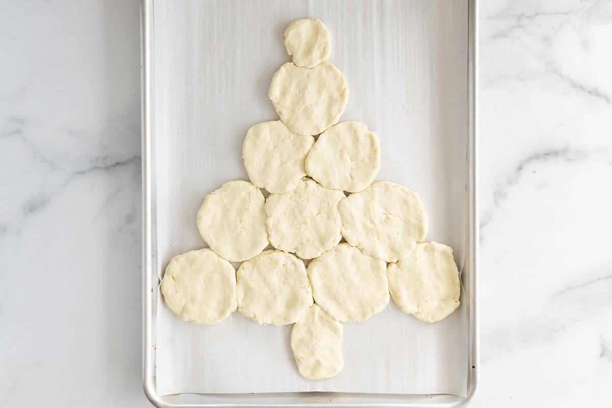 Dough on baking sheet for christmas pizza.