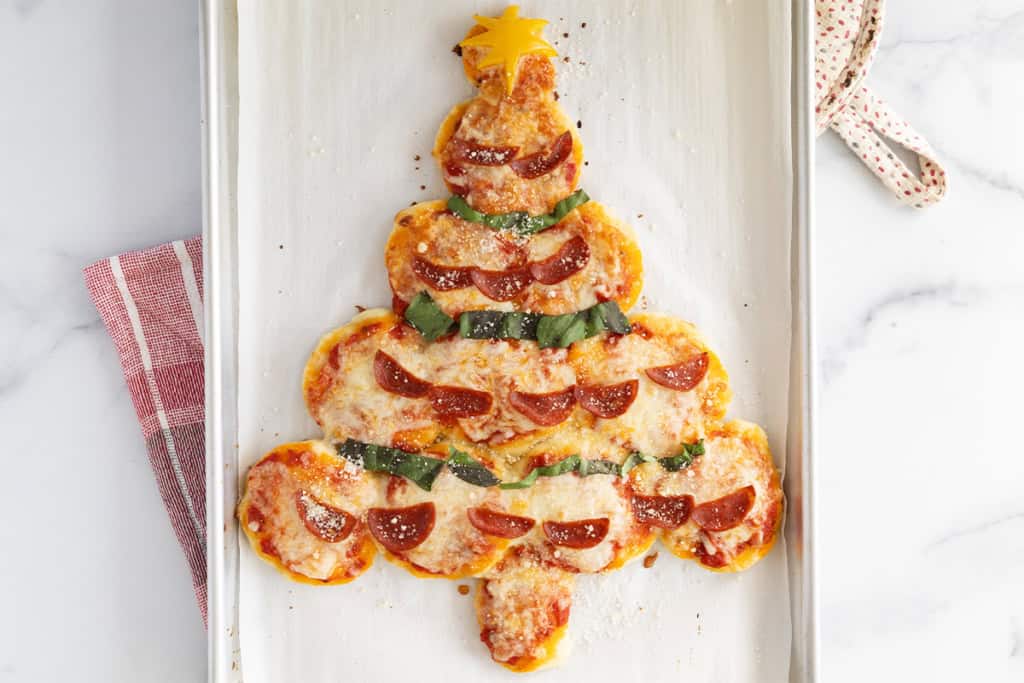 Christmas pizza on baking sheet.