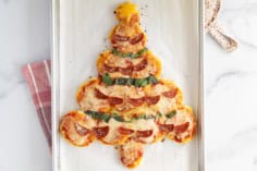 Christmas pizza on baking sheet.