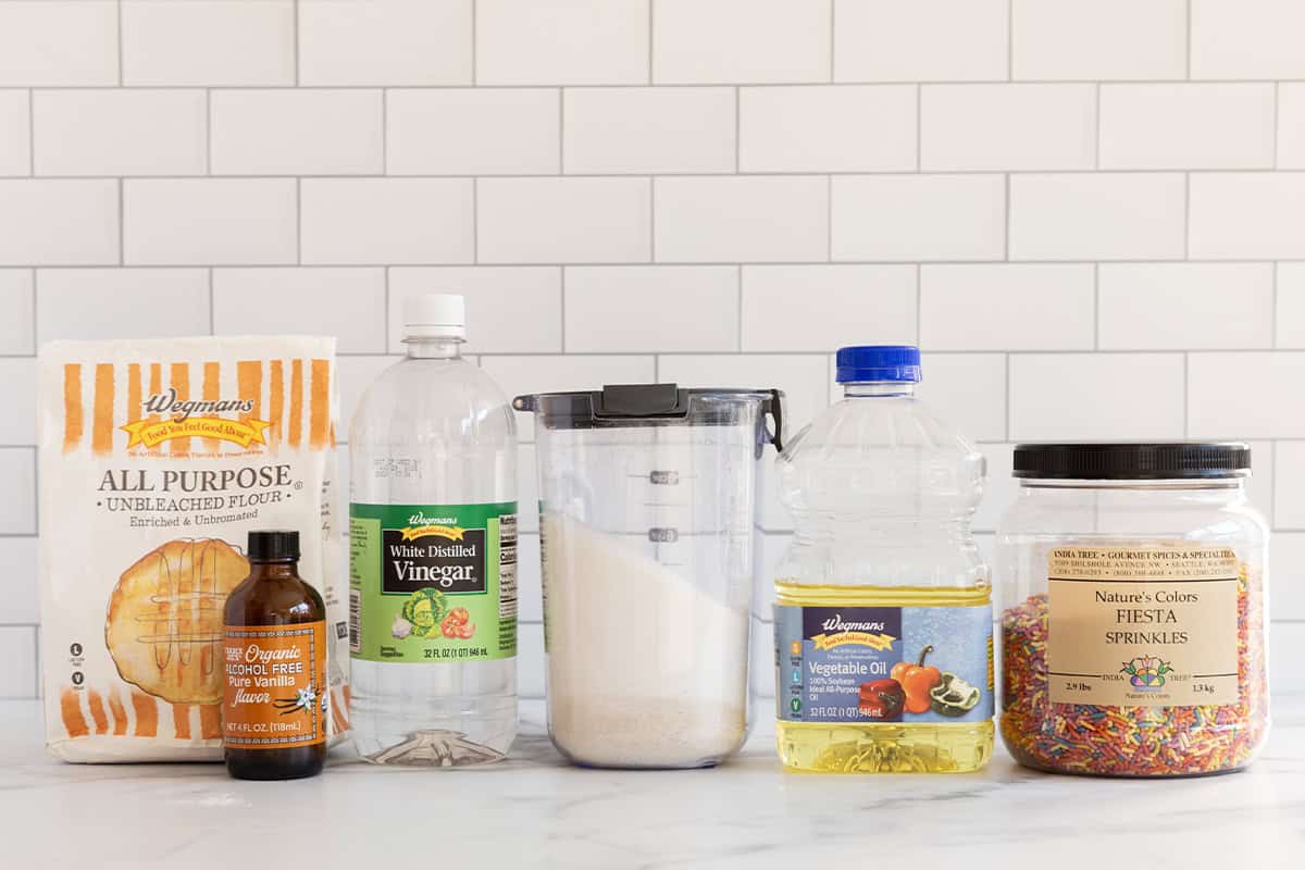 Ingredients for funfetti cake on countertop.