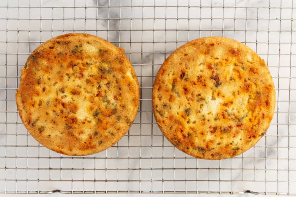 Funfetti cakes on cooling rack.