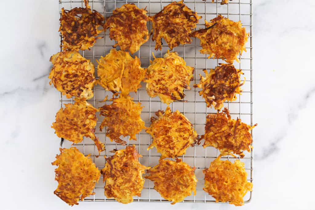 Sweet potato fritters on cooling rack.