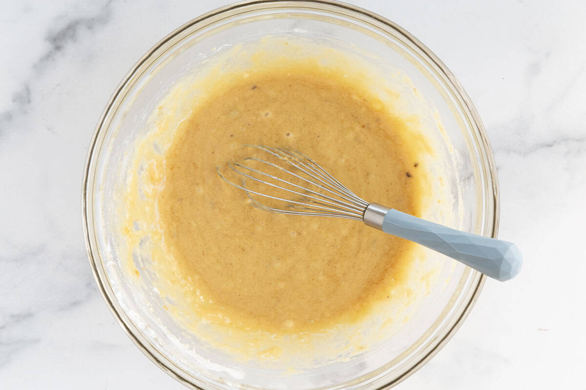 Batter for banana blondies in glass bowl.